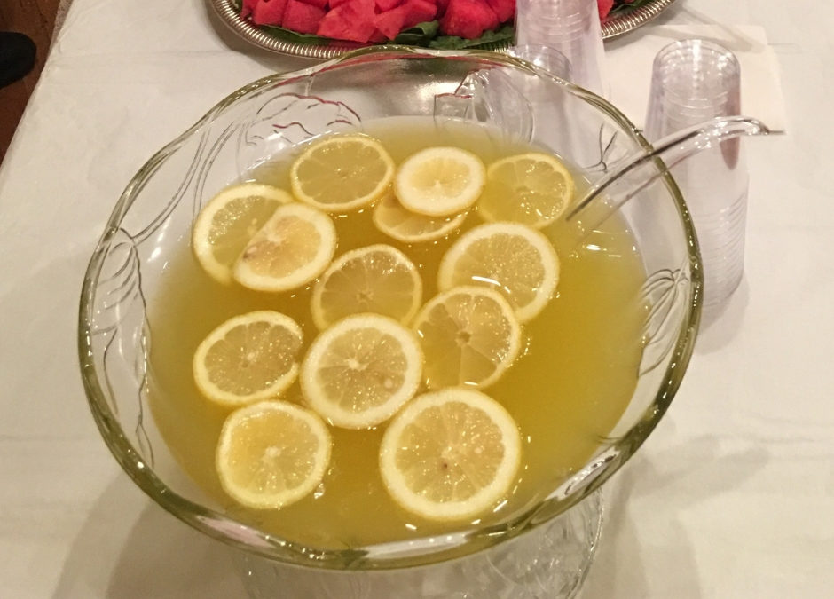 Photo of punch bowl with lemons floating in it.