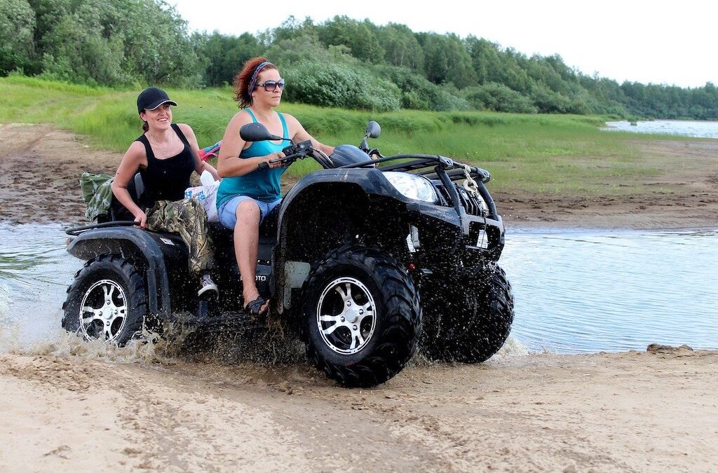 Photo of two women on a off road ATV